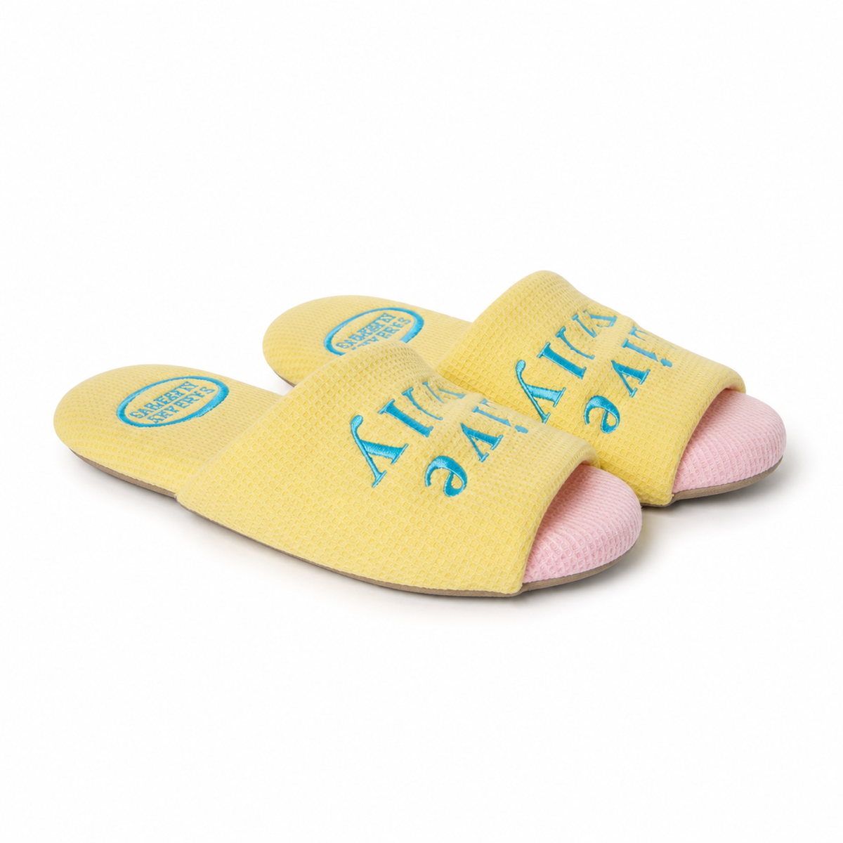 Pink and yellow Farfary cross-strap slippers on a white background