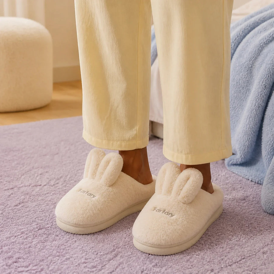Farfary Bunny-Ear Plush Slippers worn in a colorful home setting