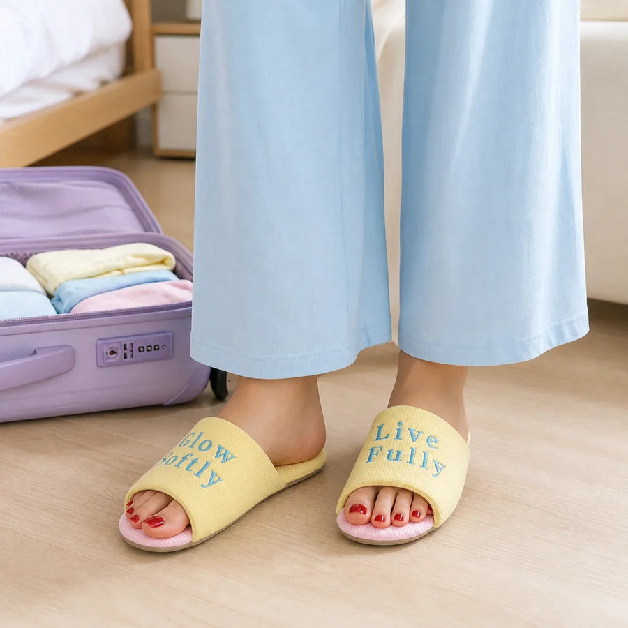 Farfary Lemon Pink Cross-Strap Slippers worn in a colorful home setting